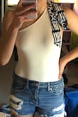 Loved this bodysuit!! I ordered a medium as that is my usual size. It was a little too big when I first put it on, but I just had to tie the adjustable strap much tighter and wore sticky bra cups with it. Super excited to wear soon! - Molly A.