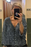Suppper soft and comfortable! Normally buy mediums but happy I purchased the small. Wearing it to work is perfect. If you lift your arms up it does slide up a bit, but that is with any cinched shirt. Love this! Would buy in other colors. - Leah W.