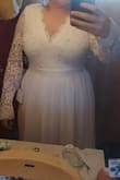 I was so excited to order this dress for my upcoming wedding. After trying on the dress it's just not what it seemed to be. I didn't like the sleeves and the way it looked. - Brittany W.