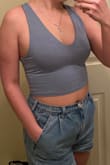 I absolutely love these tops! I bought one in white and one in blue. White is a little see through but with a nude bra it wouldn't be a problem! I'm usually a medium and they were true to size! Shorts are American Eagle mom shorts btw - Sara W.