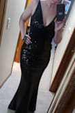 I loved that the material had some stretch.  I got a Large, and it fit PERFECTLY.  The sequins helped camouflage my tummy a little bit, so I felt comfortable and beautiful. - Andrea M.