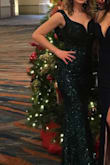 I wore this dress to my work holiday party and I got so many compliments! I decided to go with green instead of red (like everyone tends to wear). I ordered an XS and I will be honest, it was a little tight but it all worked out! I wore a black strapless bra but I had to have my friend check that it wasn't sticking out on the backside the entire night so maybe sticky silicone cups would've worked better! Still loved this dress nonetheless. - Paula V.
