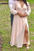 This dress is BEAUTIFUL. I wore it for my engagement shoot and it was perfect. The split is a good height and it blew in the wind perfectly for the photos. My only complaint is that it runs a little big. I typically wear a L and I ended up wearing a M in this dress. The pictures you see are the medium. I'm also above average height and I was walking on this dress in 3" heels. Definitely a good quality purchase, just need to get your sizing right. - Shauneil S.
