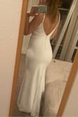 Bought this dress for my quickie Vegas wedding & couldn't be more satisfied! Dress fit perfectly! It hugs your figure in all the right places! Very flattering fit & cut. - Ashley R.