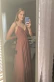 This dress is exactly as pictured! Fits a little tight but I wouldn't size up. Fits me perfect in length (with heels) which is something I was worried about since I'm a little taller! - Erika T.