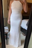 It is definitely right on the brink of possible wanting to size up but I put this on at the end of the day when Im usually the most bloated and it still zips up. I love this because I have broad athletic shoulders and back and this did not make me feel that way at all. So pretty!!! - Lauren B.