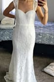 This dress is beautiful, just like it shows on the website! My budget was a lot higher, and I went to many bridal stores. In the end I loved the Lulus dresses the best! The style is extremely comfortable - you could even wear a strapless bra if you like to add some padding. It runs a bit large and it has a stretchy material. I would definitely exchange for an XS for myself. The skirt has a lovely mermaid shape, which shows off your hips but still lets you move around comfortably. The color is a true white. It would be just perfect with a rhinestone belt. I was almost gonna choose this one, but I went with another Lulus dress since I loved the styles with nude underlay and white lace. - Ayca C.