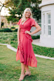 This dress was beautiful. I loved the color and length. I did however have to get this altered in the chest area because it was way too big. But once it was altered it was perfect. - Maddie B.