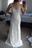 This will be my wedding dress!! I was looking for a dress with the budget of $600. I tried so many more expensive dresses and did not like them. I decided to try ordering a few dresses from Lulus. Every single dress I tried from this shop was much better than the ones I tried in local stores! And the price for this style and quality is incredible!! I am amazed with the gorgeous combination of the white lace and the nude underlay. It compliments my skin tone beautifully. Either the back or the front is too revealing, so I could wear a padded bra underneath. I was considering a dress with no train until I tried this one on... It is just amazing. The most beautiful train I have ever seen! The fabric is not stretchy in this one. So the small size worked well since I have a pear shape. I will need to get the length, waist and the bust altered a little. Only thing I would wanna change would be adding some details to the straps. Can't wait to wear this on my special day!!! - Ayca C.