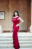 I bought this dress as 1 of 2 outfits for an elegant engagement photo shoot. The color is a stunner! Our pictures came out beautifully. I ordered a L and the dress was a little loose in the waist but hugged all my other areas well. I love the ruffles!!  I'm tall and the dress was still long enough for me to wear heels with it. - Rajany M.