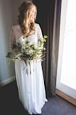 My Wedding Dress was everything I wanted in a dress. Loved how it was sweet and modest while having a beautiful open back and the lace detailing is stunning. Had to do some minor alterations to make it fit perfectly but I loved it. - Shyanne M.