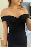 The dress fit nicely - it fits perfectly around the tummy area, but is a little loose at the top. I had to wear a bra with it to make it fit better, but wouldn't return it since it fits fairly nicely. - May L.