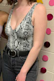 This bodysuit, LET ME TELL YOU, it's so comfortable, the material is so soft, and it's so cute. I have gotten tons of compliments on it. I would totally recommend. The neckline is just low enough to be a great going out top but it's not too low that you are worried about your bust popping out. - Ruth I.