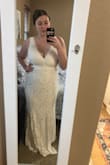 We had to postpone our big 200-person wedding due to the COVID-19 pandemic and decided to do a small backyard ceremony on our original day. I didn't want to wear the expensive wedding dress I had bought months before, so I scrambled to find something more simple and elegant for a small backyard ceremony. This is the perfect dress - I couldn't be happier.
I'm on the curvier side and this dress makes me look so thin. It's the softest fabric and the bottom of the gown is flowy and elegant.
Coronavirus may have ruined my original wedding, but it gave me the chance to find this perfect dress! - Marielle L.