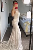Saw a lot of GOOD reviews, a lot of amazing photos from other buyers. I love how the dress looks in the back. My husband liked it too so he bought it for me. He was just like "OMG" when he saw me tried it on. Highly recommended! - Thanh P.