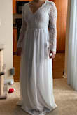 I had to postpone my April destination wedding til December due to COVID-19. I had a gorgeous dress ready. We decided to still have a ceremony and reception in December but will still be exchanging our vows in April since we had the license and we waited long enough. Got this to elope. I'm in between sizes so I have two dresses in a small from Lulus and had to get a medium in another. This was very snug where it clips, but the Medium would have probably been too loose around my bust since I can't wear a real bra. It's very long on me as well since I have a longer torso and shorter legs. I am having it hemmed and adding a half inch to where it clips so it is more comfortable. It's beautiful and I can't wait to wear it in a couple weeks! When I tried it on my fiancé couldn't stop smiling! - Jessica S.