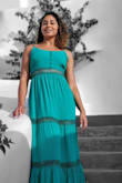 I wore this dress in Greece and the color was beautiful. The dress has no stretch so if you have a larger bust, that area may fit tight. Otherwise, it is such a beautiful dress. - Christina F.