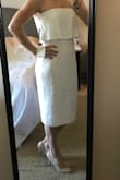 This dress is flattering! It's a little loose, but probably for the best as I'll be wearing it to my shower in front of my aunts, in-laws and Grandma! It hits just below the knee for me. I would like it a little shorter, but again, I could definitely wear it in church with a light sweater. No bra needed and hides all tummy/booty imperfections! - Ashlyn L.
