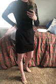 I am not sure if I ordered this dress too big (I ordered a small) but it wasn't as tight-fitting as it appeared in the pictures. The sleeves were too short but the body of the dress was too long and big. The high neck was a little odd fitting. Great material though and seemed like a quality dress other than the way it fit me! - Talia T.