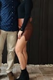 Been wanting a "leather" skirt like this for a while and so glad I got this one. Very comfortable and not too short on the back! Love the color - Kennedy S.
