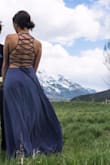 I wore this dress for prom and it was so beautiful. I am obsessed with the open lace-up back. With the lace-up back, you are able to make it as tight as you want so it fits perfectly and with heals the length was perfect. The material is very very delicate though so super small things like the oils from your fingertips are able to stain the dress and I can't figure out how to get these stains out of this fabric. The color looks very different in different lighting. - Kylie O.