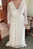 My fiancé and I were suppose to be having a big wedding May 2020 - due to Coronavirus we had to postpone and decided to do a small wedding with parents and siblings only and push the reception to 2021. Not wanting to ruin my true wedding dress I decided to start looking for another cheaper option that would work and after trying multiple dresses I finally fell in love with this one for the small wedding! It fits amazing and is better quality than many of the other dresses I tried from other stores. It will need some alteration as it's REALLY long and with a 32G chest I will need a bra sewn into it (don't mind the sagging bust in the picture it looks a million times better with a bra). But otherwise it's perfect! I wear a US 10/12 and the XL has room to spare on the waist just needed it for the bust area. I would say a L would fit but would be tight on my bust. - Danyell K.