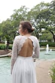 I've had my eye on this dress since I got engaged in 2018 but decided to get a a bigger, more expensive looking dress for my church ceremony. Except that my church wedding had to be rescheduled because of the COVID-19 pandemic! So I decided to buy this dress for the tiny ceremony we had in the backyard and save the other one for when we get married in the church. I couldn't have asked for a better look! It's comfortable and looks amazing in pictures/video. It does fit a little big though. I ordered a small and wish I would have ordered an XS. I had to take in the shoulders and tape the low neckline to my chest so it wouldn't show anything. - Sally M.