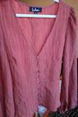 I thought the color would be more brighter and lighter, similar in the photo. It came wrinkly but that's an easy fix! It runs a bit tight and it's a short top.  But I would recommend this one!!! - Sarah R.