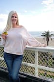 Love it!! I wear it a lot. It's a cute off the shoulder look, warm and cozy but not too hot in the sun. - Elle P.