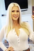 I love this top. It's flattering in all the right ways. The bodysuit isn't uncomfortable at all. It is thin so I have to wear a bra or 3 pasties each... I got chocolate on it and I cannot get it out and that upsets me. - Elle P.