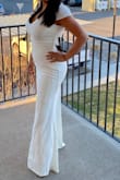 I love this dress. The fabric is soft, thick, and stretchy. It's extremely flattering and comparable to expensive dresses. The zipper is strong and doesn't feel fragile. The color is an ivory/cream not a white.
I would recommend this dress to anyone who is looking for an alternative dress. My only qualm is that I wish the sleeves were a little longer since you can see my bra fat. I prefer the sleeves from their "Undying Love White Lace Short Sleeve Mermaid Maxi Dress" but the fabric and zipper from this dress. - Angelica G.