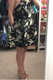 I couldn't wait to get this dress! I was so hopeful and when I tried it on, I was in love! Bodice is fitted and the skirt flares out and has an elegant silhouette. I can't wait for an occasion to wear it! I read reviews that it's black and not charcoal like in the pictures, and that's why I got it- I love that it's black; also the gold really pops! The shoes are Lulu's gold heels and they are great too! - Denise P.