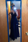 This dress is exactly like the picture! It fits a little different on me than the model, and it was really long. I'll have to get alterations to take off the length and take in the sides under my arms because the top is loose. But overall it is really pretty, especially for a bridesmaids dress! - Cara S.