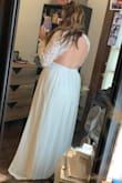 Over all its a wonderful dress! Really happy with the fit. I would usually get a large size, but went for an XL because I think the site over all runs a bit small. So with that in mind, the dress fits pretty well. Its a tiny bit long, I'm going to have it hemmed just a smidge. The thing I would change the most is the sleeve where it connects to the body of the dress/armpit area is a little baggy. I plan to have that taken in as well as long as it doesn't mess up the back. The dress would honestly be fine without the tailoring! But I got the dress for my elopement ceremony and don't mind getting it altered to be perfect. It is close to it to begin with. It looks great from the front and the back. Great dress for the price! - Rebecca A.
