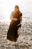 I ordered this dress for maternity photos and I was worried it wouldn't fit because I'm in the 3rd trimester, but it was nice and flowy / stretchy! The waist is high enough to accommodate a big bump! I love the dress. I'm 5'8" and 180 - Shealyn