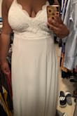 This dress was truly an amazing fit. I was a little nervous when ordering because I didn't see any larger sized women writing reviews about the L or XL size but I can tell you that at 220 lbs it was a great fit. The bottom was flowy so my wide waist wasn't an issue. I did have the bottom hemmed by an inch because even though I was wearing platform sandals it was a tad bit too long for my taste. Other than that this dress is truly beautiful. - Natasha M.