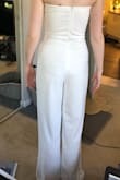I bought this for my bachelorette party and loved it!! It was perfect! A tiny bit big on top but it has elastic on the top so even though it's strapless, it didn't fall down. The legs are pretty wide and it was definitely too long - I should have had the legs hemmed - but with some tall heels it was pretty much fine. I also wouldn't say it's see through but I would wear white or nude underwear with it. Overall, I love it and would definitely recommend! It's easy to style with some accessories or even a jacket! - Katie L.