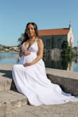 Ordered this dress for my maternity pictures, literally so obsessed. Fit like a glove, I'm sure I'll be able to wear it after my pregnancy as well. The tassels in the back were adorable! Also ordered my necklace from here as well, loved it! - Maci D.