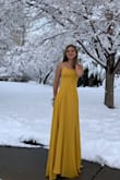 I absolutely love this dress! It has two layers of fabric with a lovely silk one underneath. I originally got it for prom, although that was cancelled, I think it can be worn for a lot of different occasions. It is a bit long but with heels it's manageable. - Lena L.