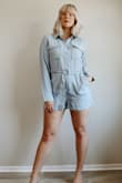 I have never been able to find a long sleeved romper that looked right on me till I found this one! I was completely in love with the color (little bit more blue/grey in the actual romper than shown in the photo) I unboxed this in a clothing haul YouTube video and I have already worn it 3x since I made that video lol Super comfy and the material is high quality and very flexible but little stretch. I sized up to a size Large because I always have trouble in the hips area but this one gave me enough room to make it a nice comfortable fit. Could have probably gotten away with a sz. M but I liked the fit of this one! The belt added to my figure and it ended up being the perfect fit! Def recommend sizing up if you want a comfy/loose, but flattering fit. - Sarah K.