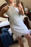 I was a little nervous as some of the reviews said the didn't think the dress was very flattering, but I had the opposite experience. I find this dress to be extremely flattering! I'm not a huge fan of the feathers along the bottom and will most likely remove those. Otherwise it fits well. I could have probably even gone down a size, but then it would have been pretty snug. - Kendall H.