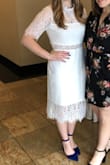 I wore this dress for my bridal shower and got a ton of compliments! The material is stretchy so I felt like I could still breathe even with the high neck line. I have more of an athletic build and short torso, so I didn't think it hit me exactly at the waist. But that wasn't enough to stop me from wearing it. I wore a bright pair of heels with it for a pop of color. - Lauren P.