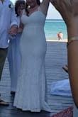 The dress was amazing! Very comfortable and looked AMAZING for the price. I definitely had the straps shortened, and it was still very low cut. Also had it hemmed, but I'm short! :) When there was a breeze, it was fine for the beach temperature, but I will say that when the breeze stopped, it was very hot... But to be expected with a long dress... - Emma C.