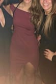 This dress fits very well but has plenty of stretch. The slit is fairly high but it's off to the side so I didn't really have to worry about anything showing that I didn't want to. The sleeves didn't ride up which was a nice change from most off the shoulder tops/dresses I've worn before. - Caitlyn F.