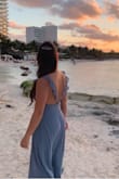 I wore this at my friend's beach wedding. It's flowy and the back is beautiful. Got many compliments! 
I had to adjust the straps and hem. - Luisa P.