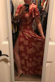 I really like this dress, the color is a dark/burnt orange color. It's a wrap style dress and has an adjustable tie to cinch in the waste. Very light material and its a bit long but I think if I wear a wedge shoe it will work. - Kayla C.