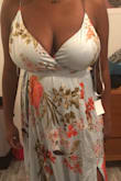 I love this dress design so much. It's super comfortable and nice on the skin. It was very hard to get on because of the string of the back. For my bigger breast gals, if you don't mind a little sag then this dress is amazing. I don't mind the way my breast look in it at all but if you want them higher then you might need a tape to hoist them up. You are able to adjust the straps to bring them higher but at one point it will be uncomfortable and dig into your shoulders.
 BE WARNED- The dress is very long. 
CHANGES TO DRESS: I am planning on getting this dress altered by hemming the bottom & if possible making the slit of the dress higher. - Stacey V.