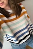 I was so excited to get this sweater, and it did not disappoint! It has a heavy knit but is still breathable and cozy. It feels like great quality and the colors really pop!It is cropped but it looks great with high waist jeans. I'm going to be looking for more sweaters like this from Lulus! - Carmen O.
