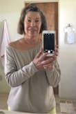 I saw this top in taupe that looked casual but still sexy. I got it and It looks great and is unbelievably comfortable. I wear it with everything, shorts, jeans, sweats. The fit is true to size I think, I usually wear a small but ordered x- small so it wouldn't hang too far down. The x-small comes to just 5" below my waist and I'm 5'1". A small would be too large on me. Great buy!! - Nancy G.