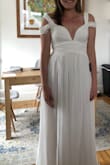 This dress is very lovely and would work great for an elopement or any bridal event really. The lower sleeves were a little baggy, but it still fit great everywhere else. I will say you will definitely need to wear a slip under it, its a bit too see through! No bra was needed, but you could where cups or covers under the bust area. The flow is nice, and the length was perfect for my height. Good dress all around for any occasion! - Victoria S.